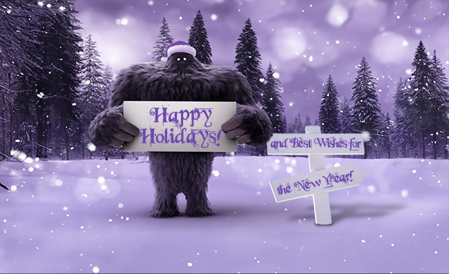 Monster in a snowy field holding up a sign that says Happy Holidays and Best Wishes for the New Year!