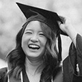 Monster’s 2024 State of the Graduate Report - woman smiling and touching graduation cap
